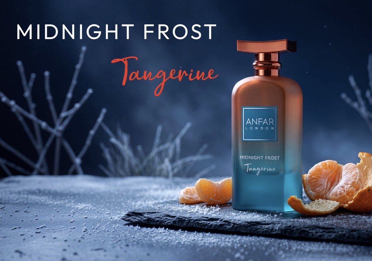 Midnight Frost Tangerine bottle on frosted slate with peeled tangerines